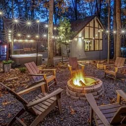 Pileated Perch cabin at dusk with firepit